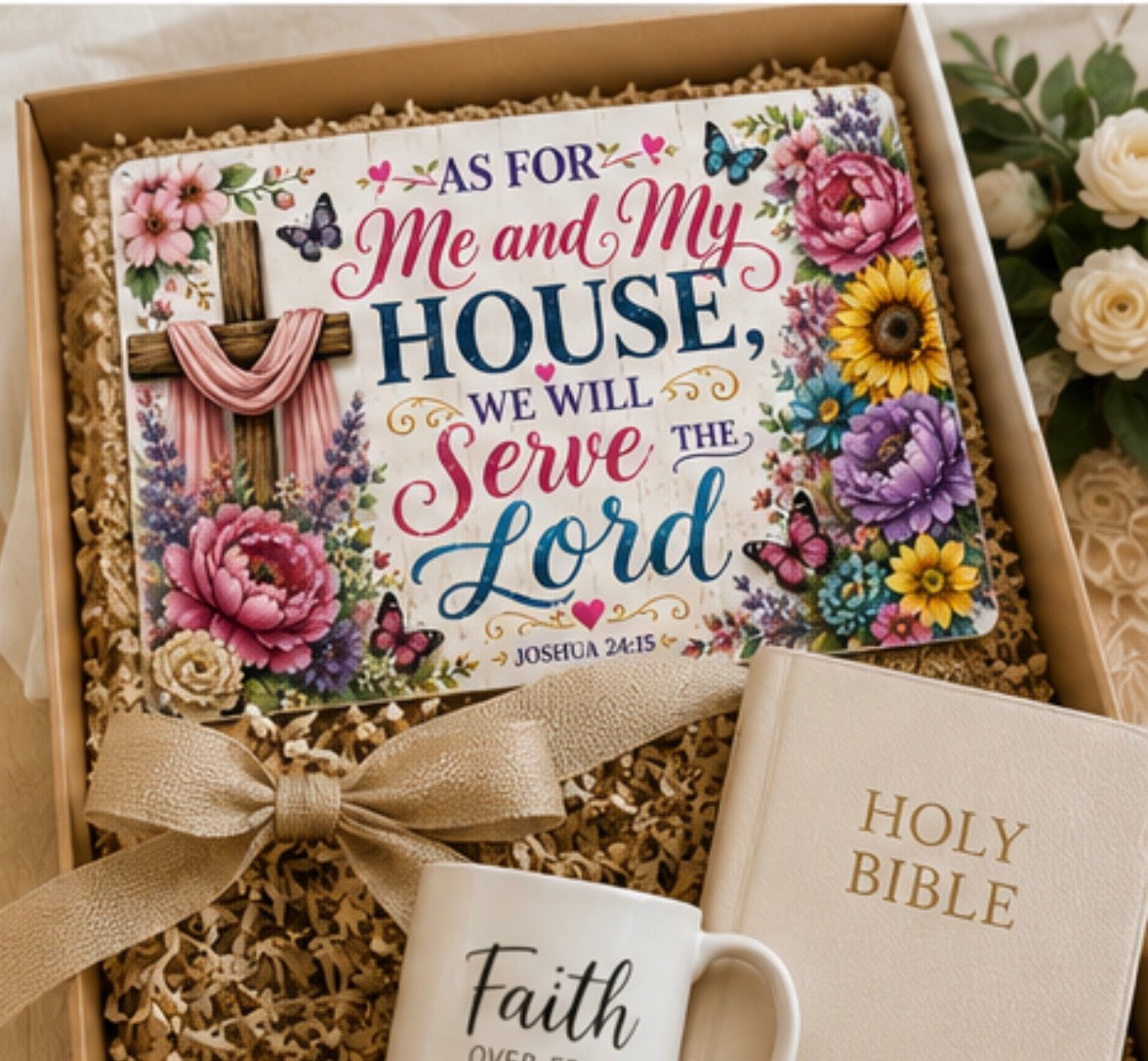 A gift set in a wooden box filled with shredded paper, featuring a colorful Bible card with floral illustrations and the phrase 'AS FOR Me and My HOUSE, WE WILL Serve the Lord,' a cream-colored Holy Bible, and a white mug with 'Faith' printed on it, tied with a beige ribbon.